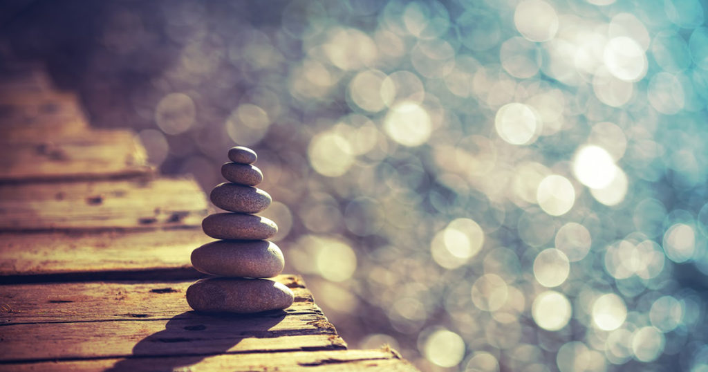 pebbles stacked on pier