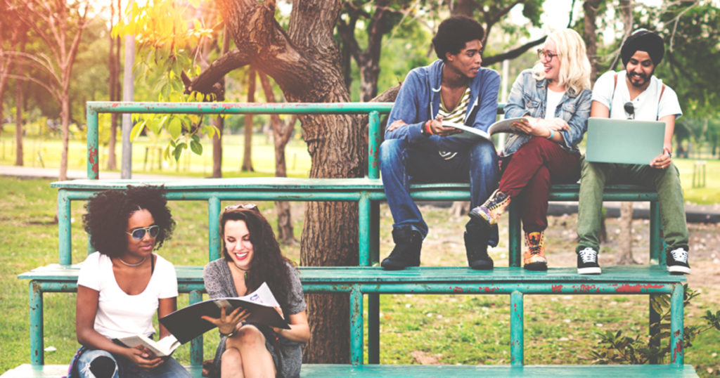 Teenagers sitting on bleachers