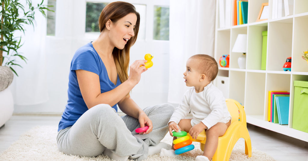 woman and toddler with toys