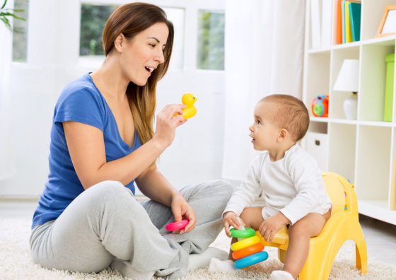 woman and toddler with toys
