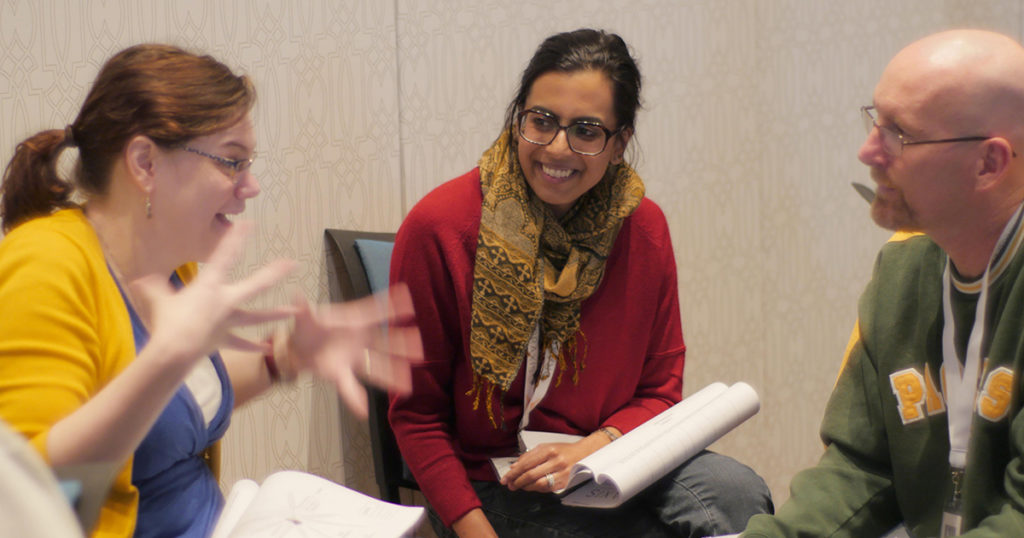 three bootcamp attendees in conversation