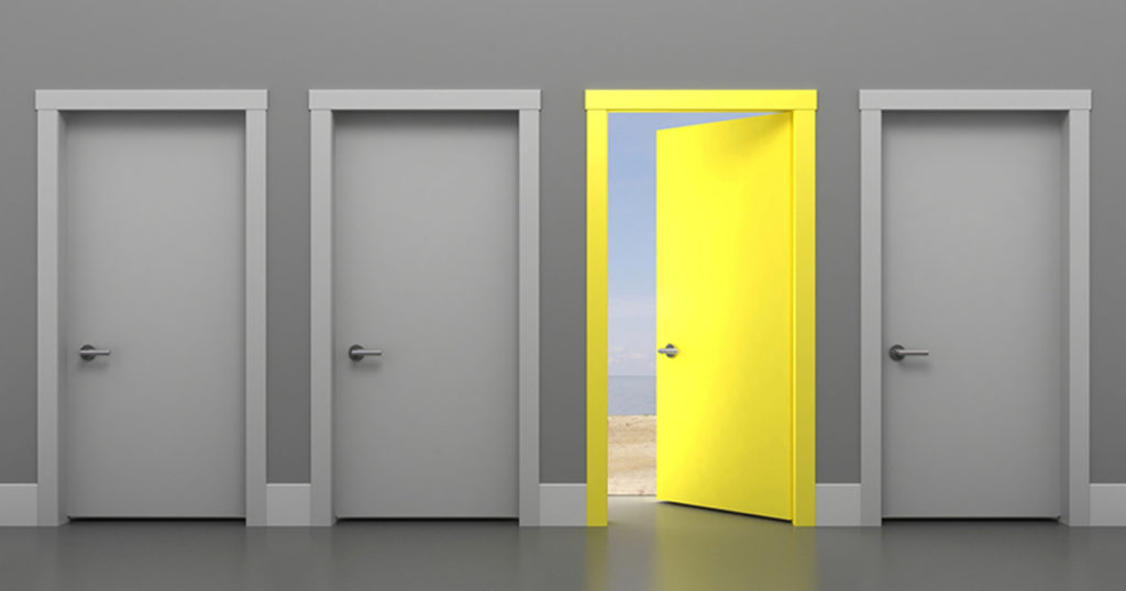 three gray doors and one open yellow door