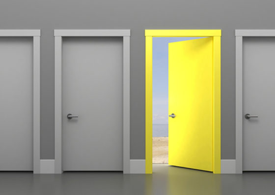 three gray doors and one open yellow door