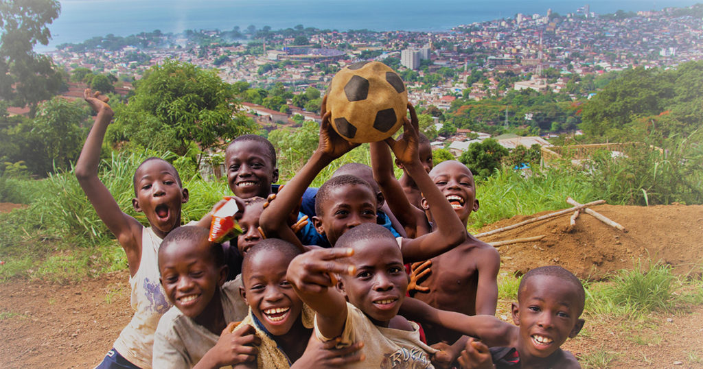 african boys playing soccer