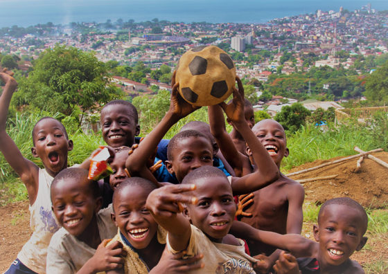 african boys playing soccer