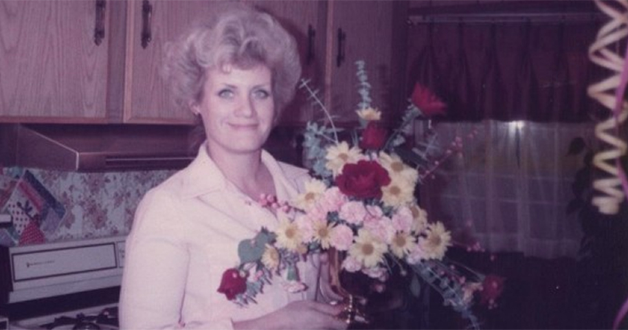 woman with bouquet in kitchen