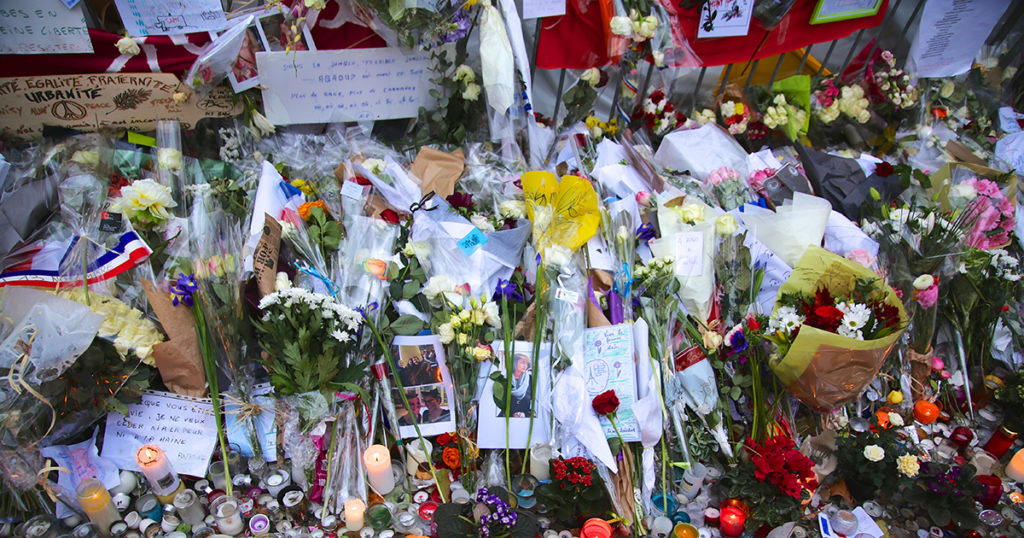 flowers and candles at memorial