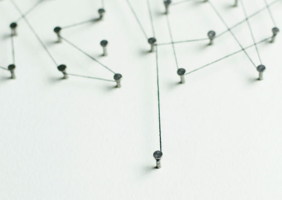 string wrapped around pins